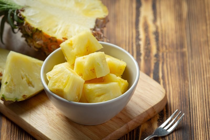 fresh pineapple on dark wooden backgroud